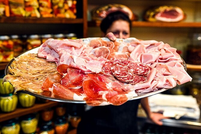 Bologna Food & Market Tour with 6 Tastings, Pasta, Wines & More - Quadrilatero Romano food market lanes and Parmigiano Reggiano shopping tips