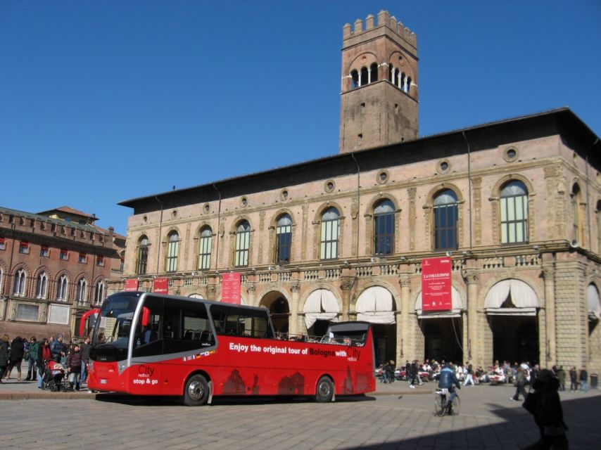 Bologna: Open Bus City Tour and Local Food Tasting - Meeting at the Neptune fountain, reserved seating, and audio guide reality