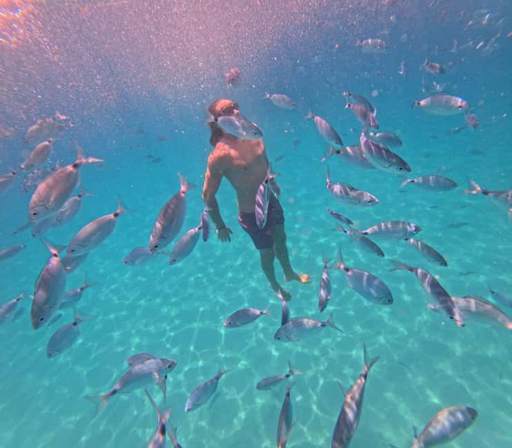 Cagliari: Boat Tour, 4 Stops, Swim, Snorkeling, & 1 Spritz - Onboard Vibe: Stories, Singing, and Bluetooth Music That Actually Works