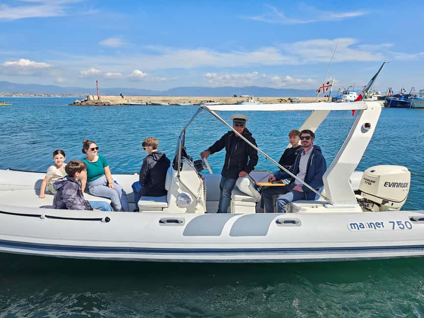 Cagliari:devil's saddle big cruise by boat drink & snack - Sella del Diavolo from the water: the main draw