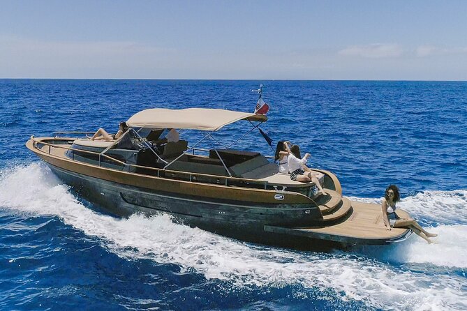 Capri Boat Tour from Naples - Small Group, Swim & Relax - Capri’s rock highlights by boat: Natural Arch and the Faraglioni moment