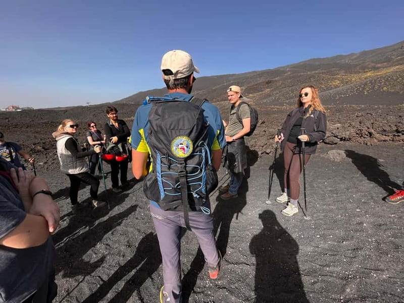 Catania: Mount Etna Adventurous Tour with a Volcano Guide - Getting geared up on Etna: helmets, jackets, gloves, poles, and trekking shoes