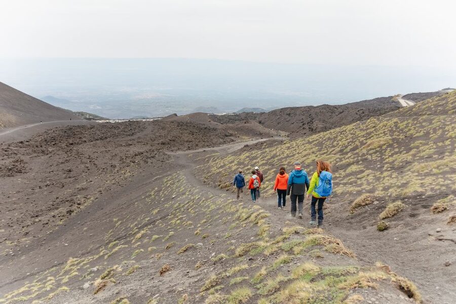 Catania: Mount Etna Morning or Sunset Day Trip with Tasting - Lava tube time: helmet, flashlight, and that cool dark air