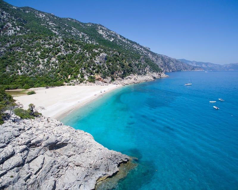From Arbatax: Full-Day Guided Boat Tour of the Baunei Coast - The swim-and-photo loop: how the day keeps moving