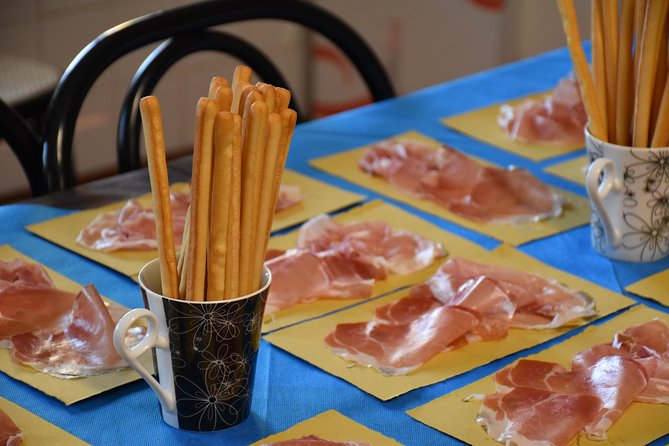 Guided group tour TastyBus: Parmesan Cheese and Parma Ham - Parmigiano Reggiano PDO at the production factory: aging you can taste