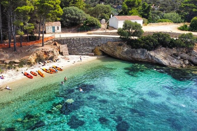 Kayak tour with aperitif and dolphins - Paddle to Cala Moresca: clear water, coves, and wildlife clues