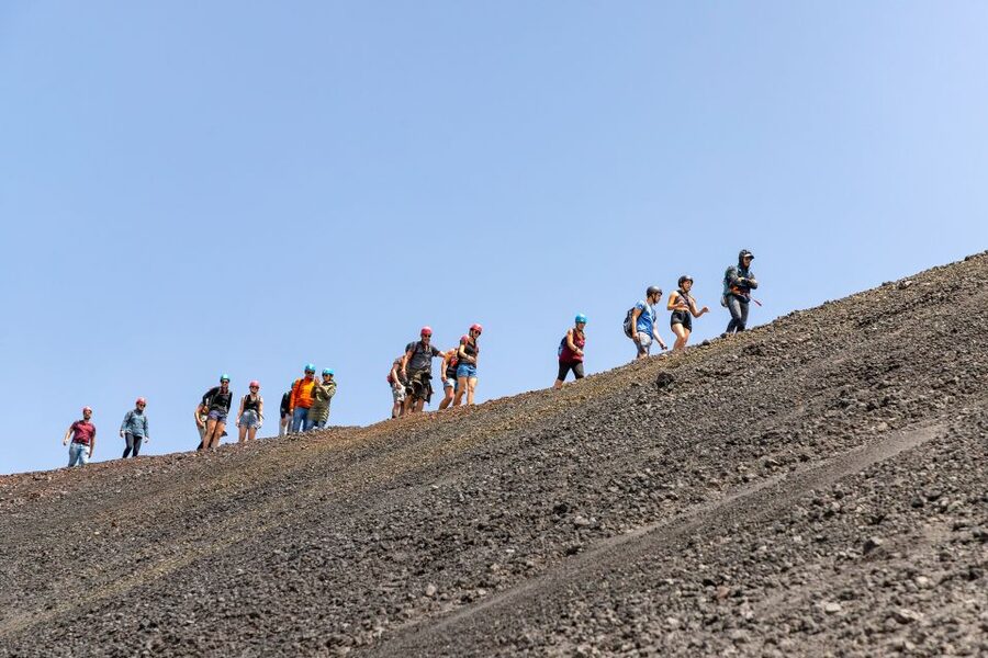 Mount Etna: Guided Volcano Summit Hiking Tour with Cable Car - Guides, humor, and safety on uneven footing