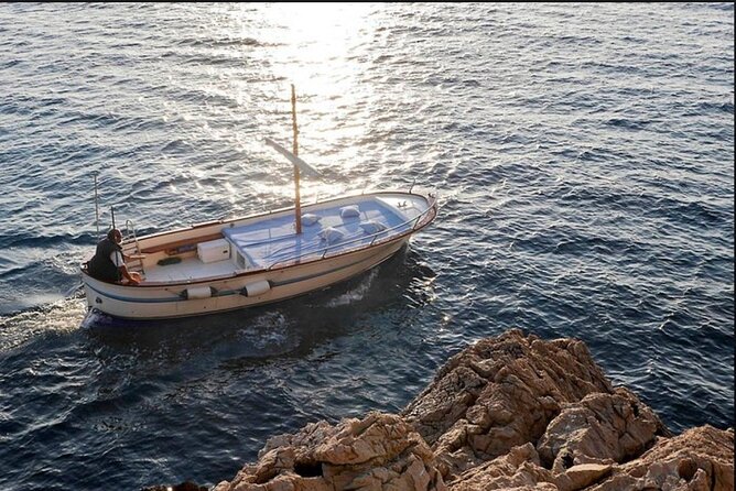 Private tour in a typical Capri boat - Grotta Verde and the “stop for real” swim-cave rhythm