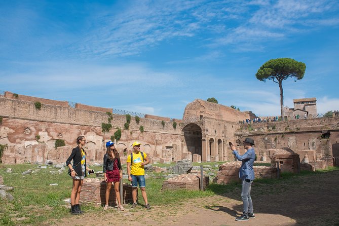 Rome: Colosseum Arena, Roman Forum & Palatine Hill Tour - Gladiator’s Gate and the Arena Floor Moment