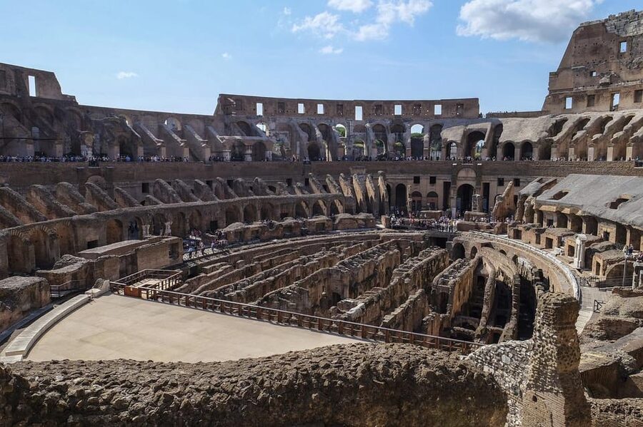 Rome: Colosseum, Forum, & Palatine Hill with Audio Guide - Entering the Colosseum with a ticket that sets the tone