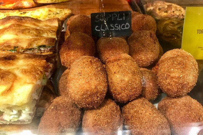 Rome Street Food Tour with Local Guide - Largo Argentina and the Julius Caesar site: gelato at the end, not in the middle