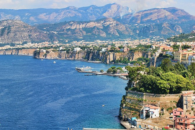 Sorrento and Amalfi Coast Small Group Day Trip from Naples - Positano hour: pastel houses, St Maria Assunta, and shopping time