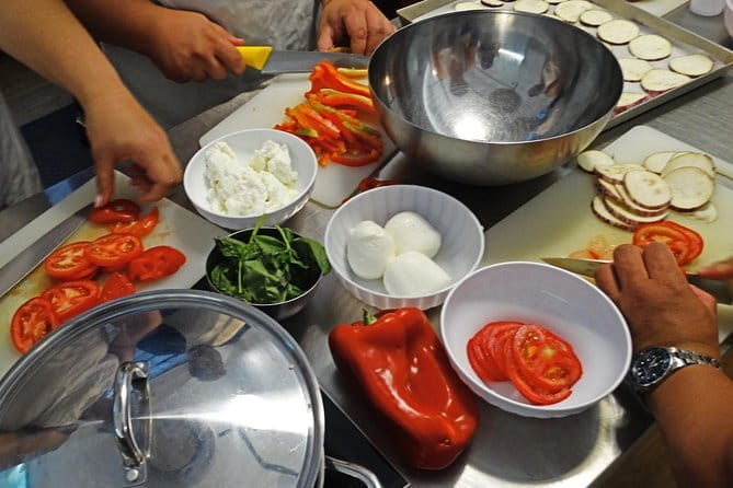 Tuscan Cooking Class and Dinner in Florence - Inside the cooking school: aprons, stations, and real technique